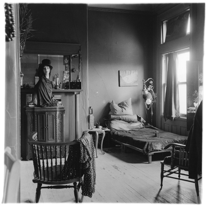 Black and white photograph of the interior of a bedroom