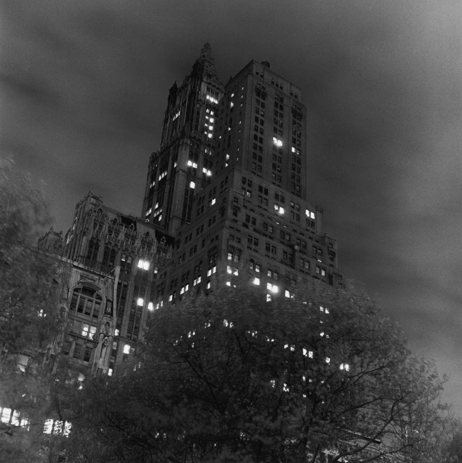 Black and white photograph of a building at night
