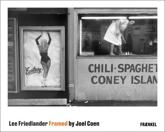 Color image of a poster with a black and white photograph of a poster featuring a woman dolled up next to a woman working inside of a diner looking towards the camera