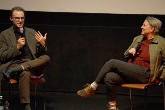 A video still features two people talking on stage