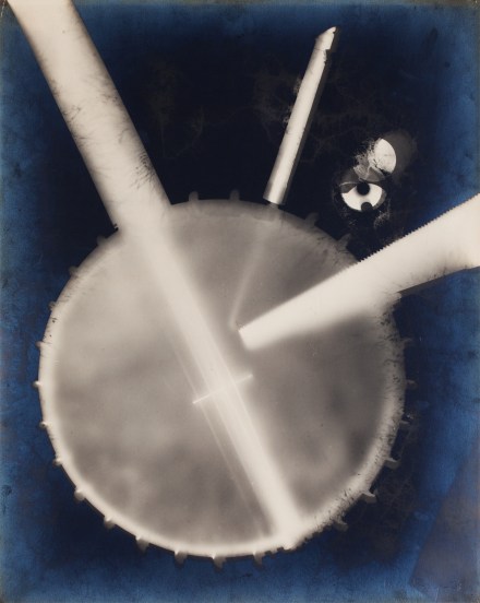 Color image of a color reversal image of a banjo on blue background