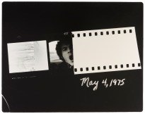 Fragments of negatives, a cropped face and a date float on a black field.