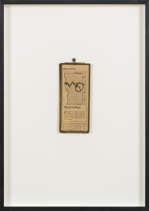 Color image of a framed newspaper graphic framed in black