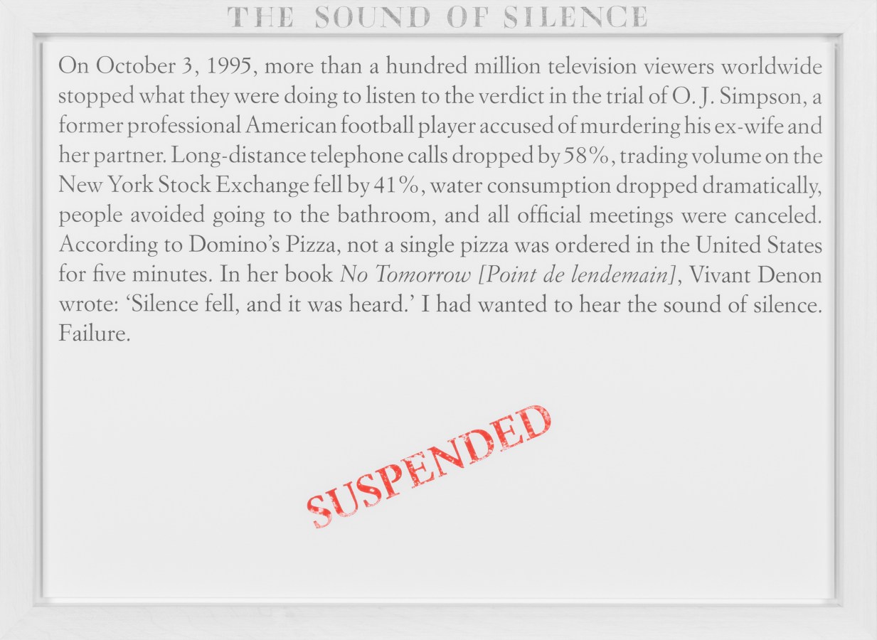 Color image of a white framed text panel with a red stamp of text reading 'Suspended'