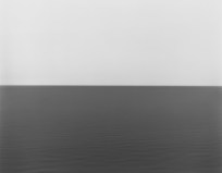 Black and white photograph of the horizon with equal parts sky and sea